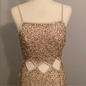 Beaded Scala gown with open back and cutout details